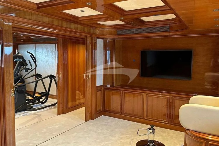 A Spa area with massage table opposite the gym, is situated between the Main Salon and the Master Suite