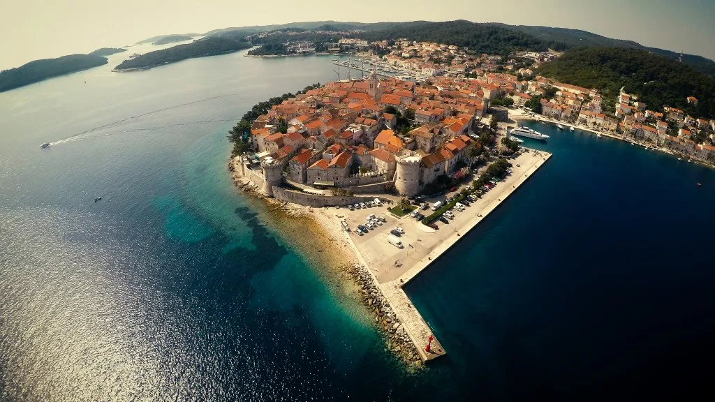 Korčula old town and its walls seen from the marina side