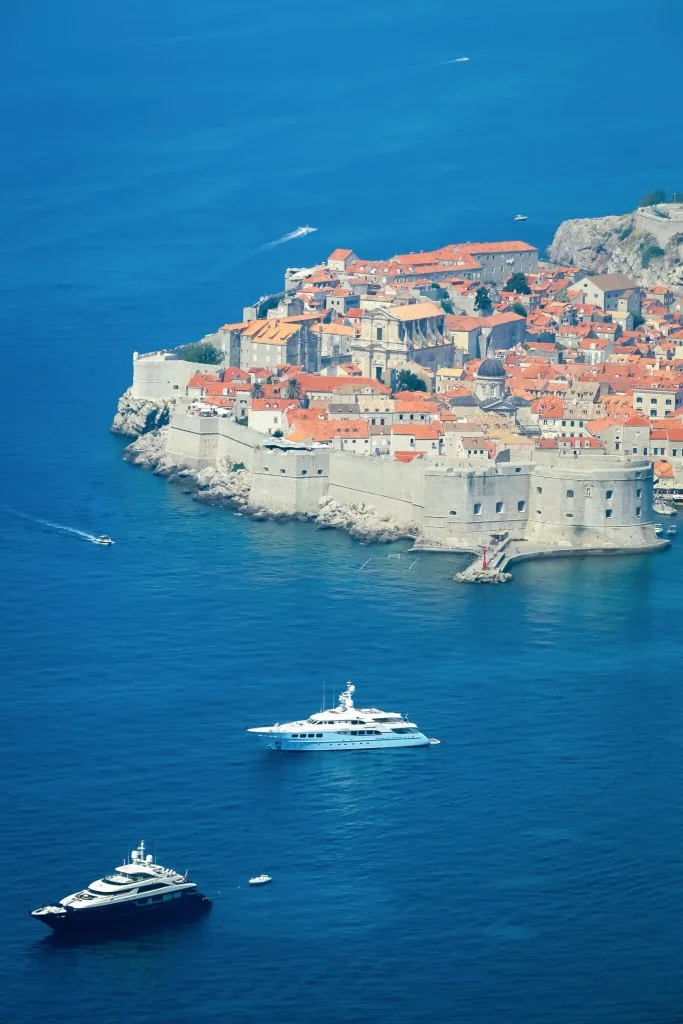 Luxury Motor Yachts anchored in front of the old town of Dubrovnik, Croatia.