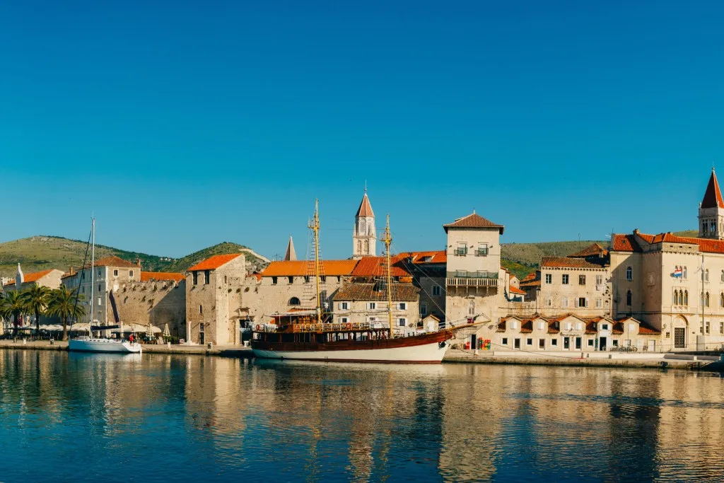 Yachts moored on the quay beside Trogir old town