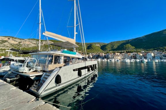 Catamaran FLORAMYE docked in Komiža town on Vis Island, Croatia