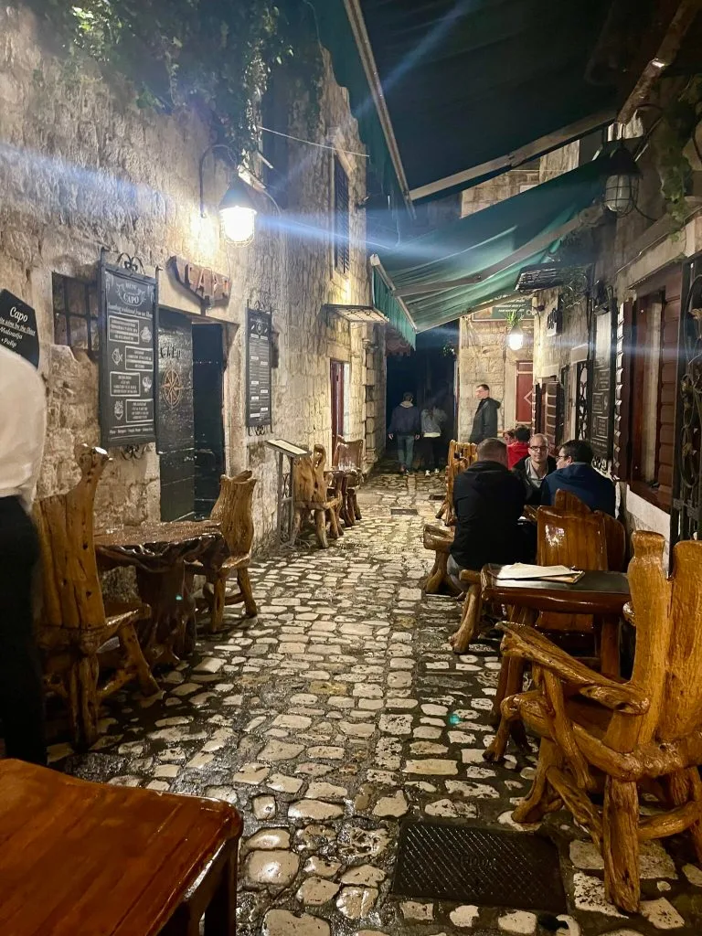 Stone lane in Trogir old town lit at night