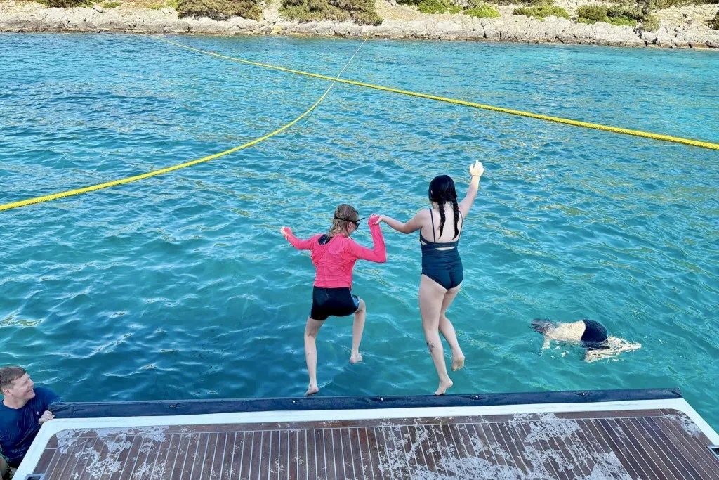 kids jumping off the swim platform copy 2