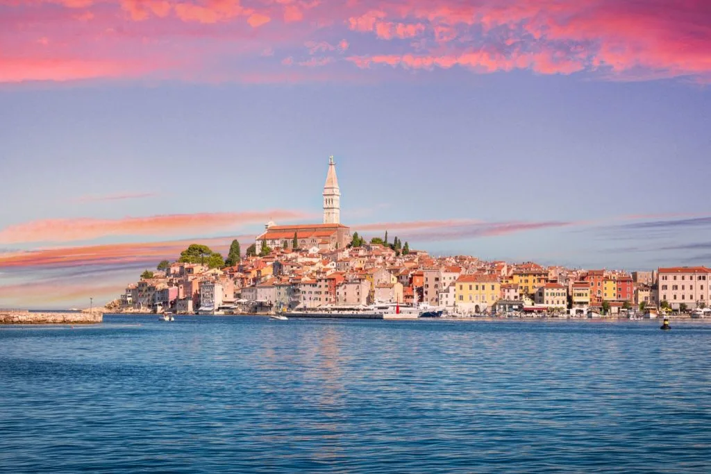 Rovinj old town and its bell tower seen from the sea at sunset, Istria, Croatia