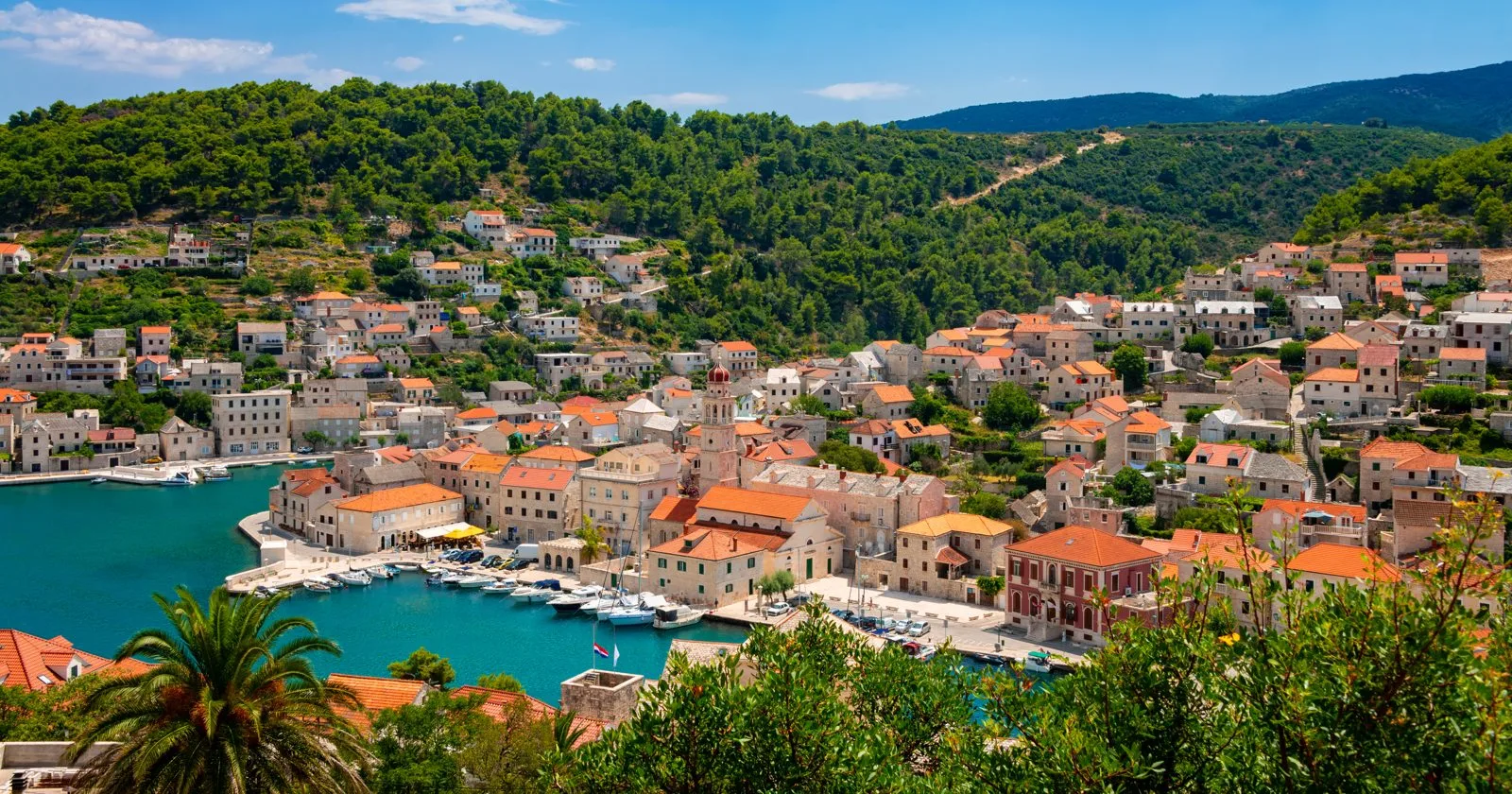 Pučišća harbour on Brač, with stone houses and red roofs