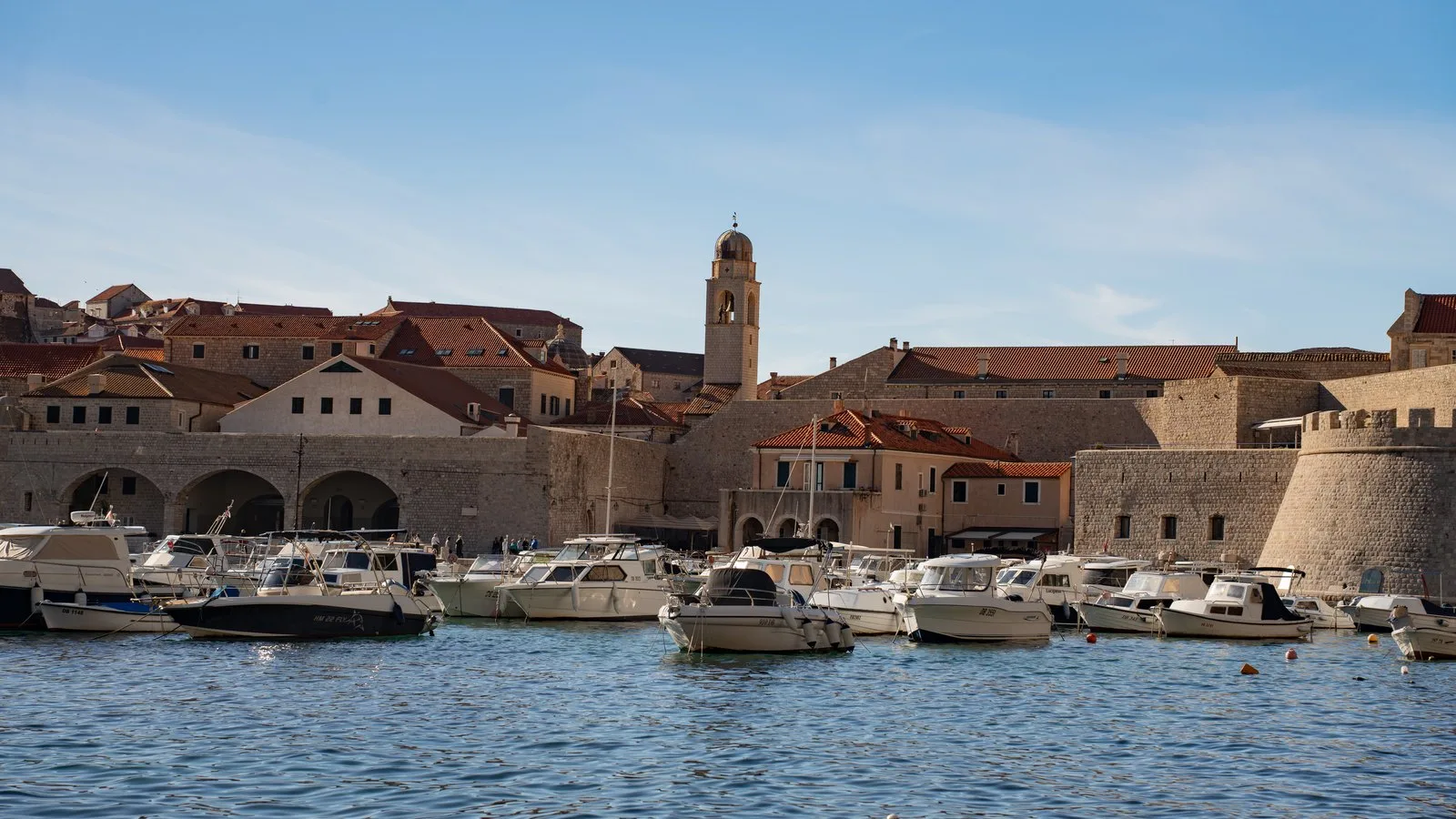 Dubrovnik old harbour and city walls seen from the water