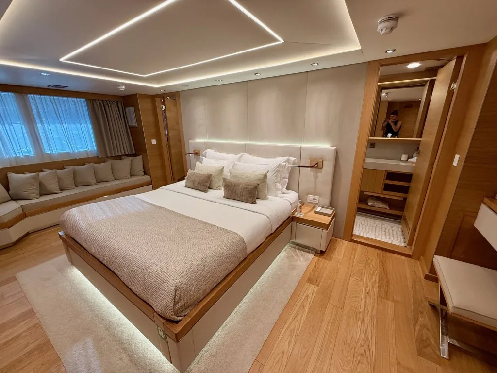 A double guest cabin on motor yacht ARGO with the en suite bathroom door open, September 2026.