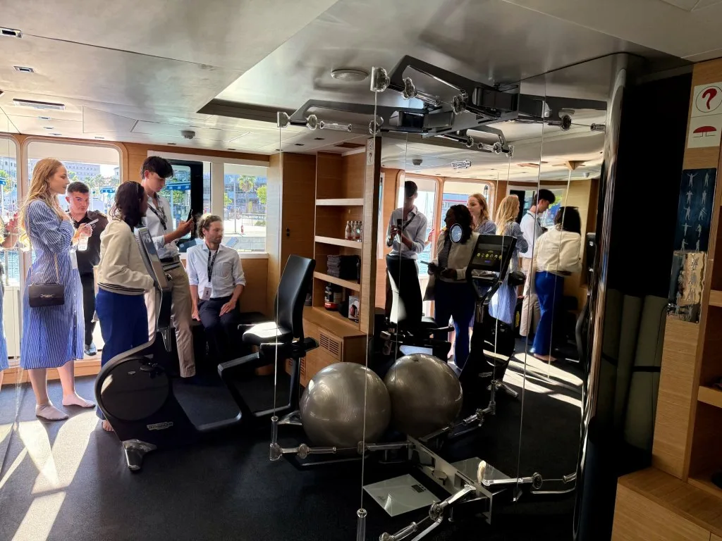 The dedicated gym on motor yacht ARGO with Technogym equipment, photographed during the CROYA show walkthrough with brokers touring the room, Split, September 2026.