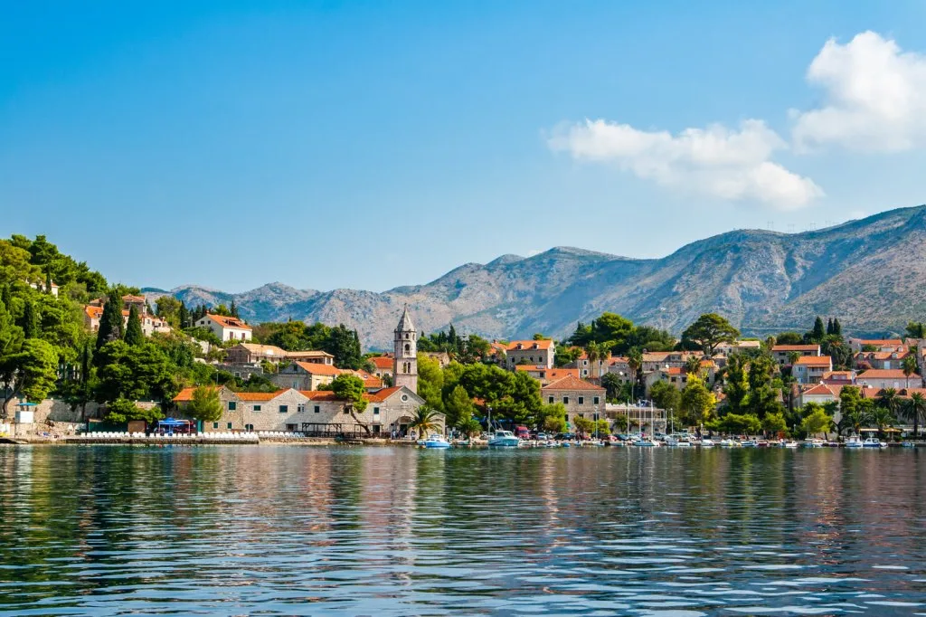 Cavtat waterfront and church bell tower seen from the sea, the Croatian port of exit for Montenegro