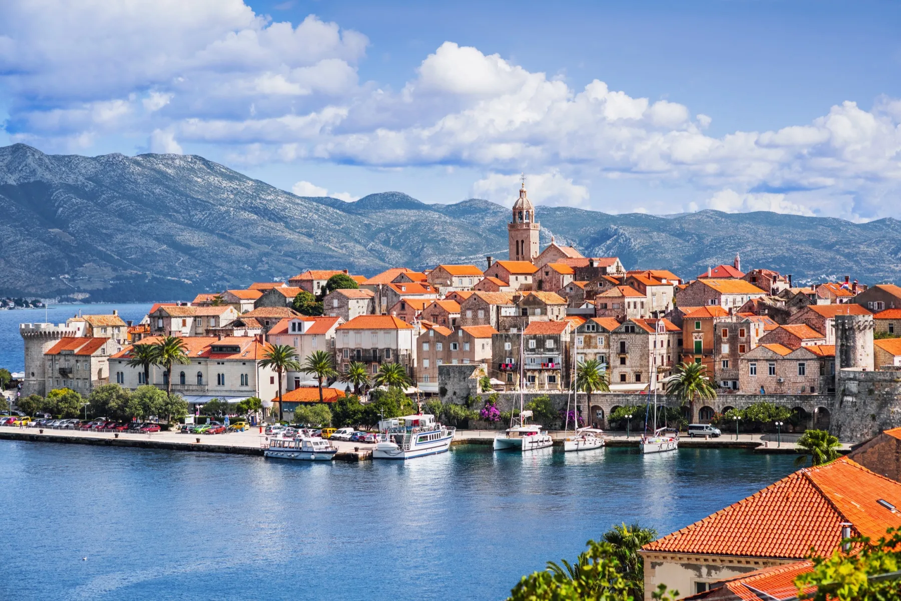 Korčula Town on its peninsula with yachts along the waterfront