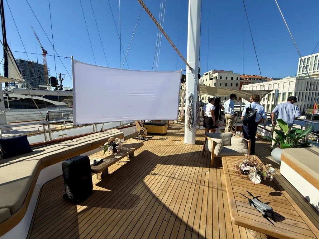 MARALLURE aft deck with the outdoor cinema screen rigged on the mast