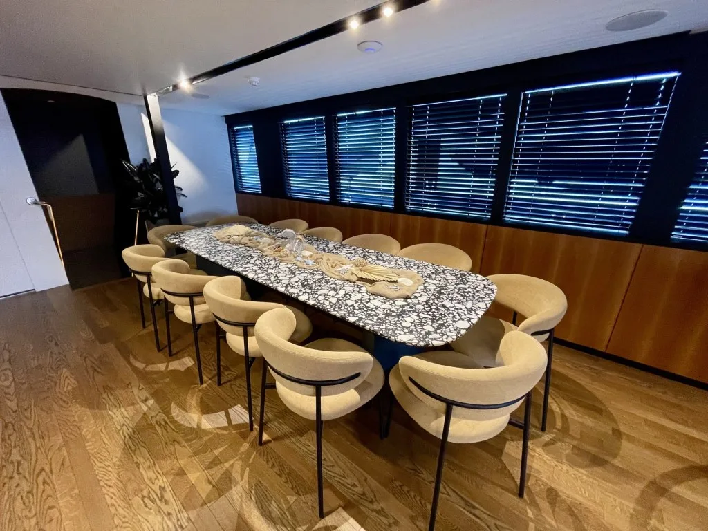 MARALLURE dining table with a black-and-white terrazzo top