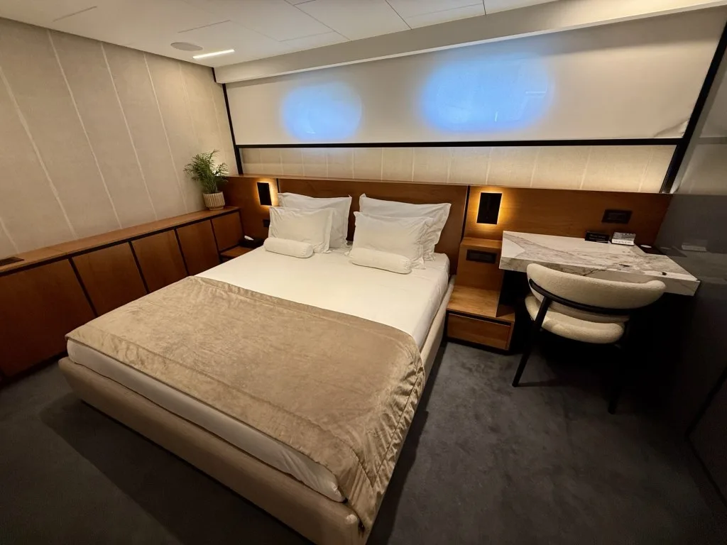 MARALLURE second master cabin with the bed, desk and marble vanity