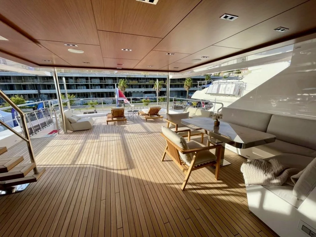 The shaded aft lounge on the bridge deck of motor yacht RENATA, September 2026.