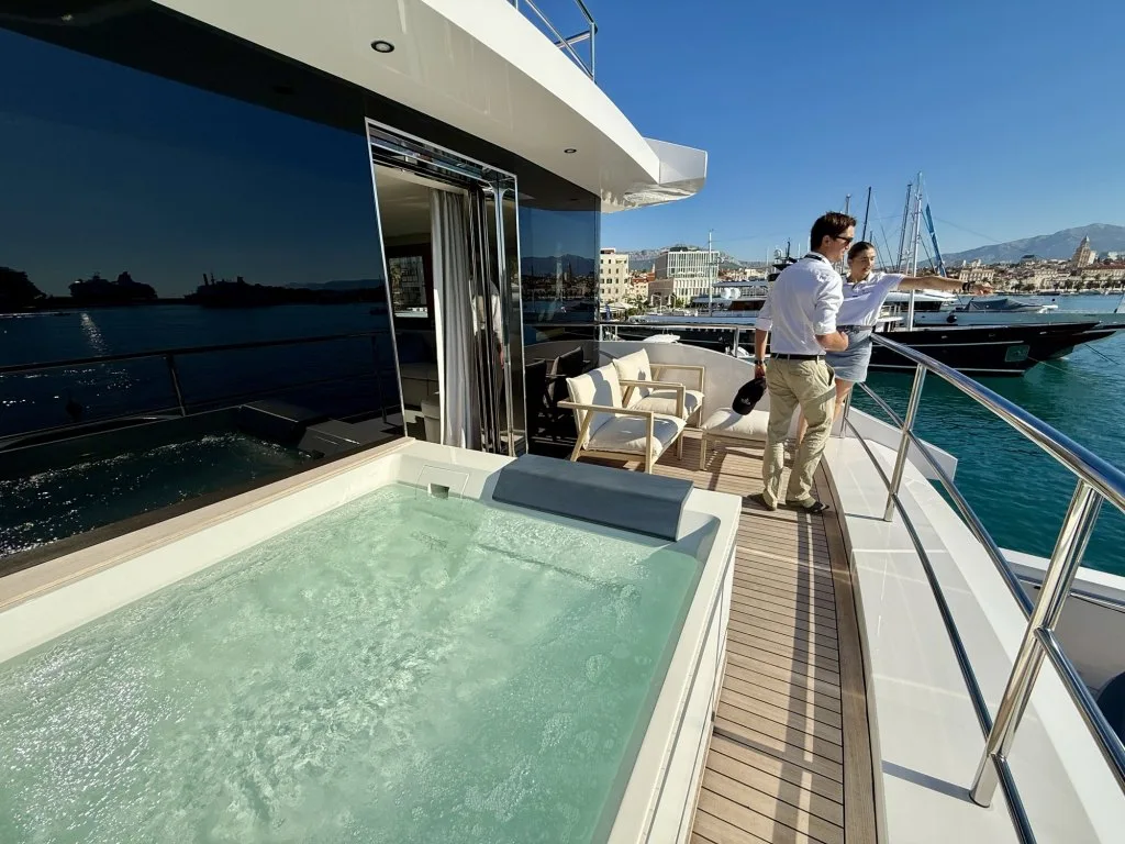 The private forward deck of RENATA's master suite with its own jacuzzi, looking out over Split harbor, September 2026.